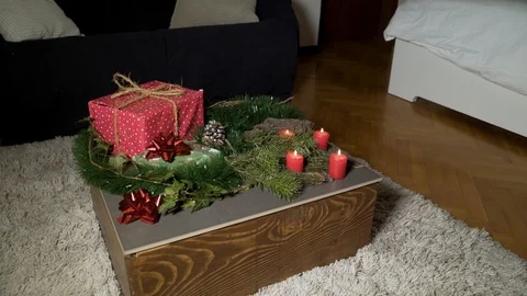 Night image of coffee table with authentic Chrismas decoration and lit candles. Stock-Footage 102658001