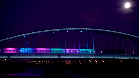 Night image of trail passing at Hendrix Bridge with lights on, Zagreb, Croatia. Stock Footage 145965996