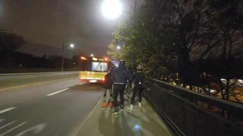 Night inline skating with motion blur Stockbeeldmateriaal 120750139