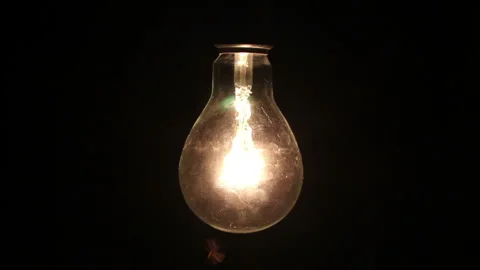 Night insects flying around a bulb Stock Footage 131614415