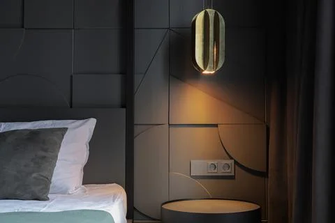 Night lamp over bedside table near the bed in the bedroom Stock-Fotos