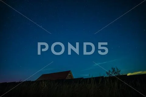 Night landscape with house under the starry sky Stock Photos