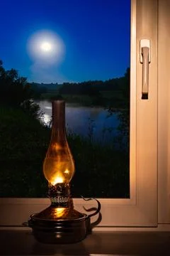 Night landscape outside the window moon old lamp windowsill night landscap... Stock Photos