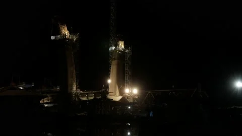 Night landscape of workers who are working at a height in construction site Stock Footage 139531432