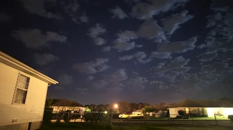Night lapse of clouds and stars in a neighborhood Stock Footage 68656264