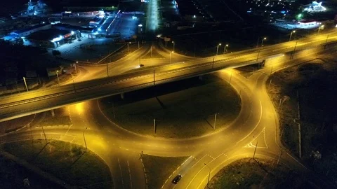 Night lateral movement of the drone over a small roundabout Stock Footage 87789987