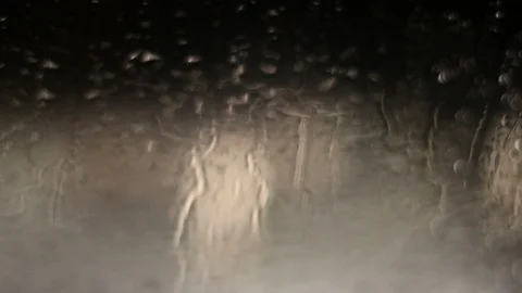 Night light glass begin rain snow Video stock 85678296