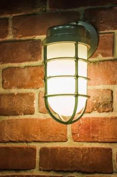 Night light by old brick wall lamp Stock Photos