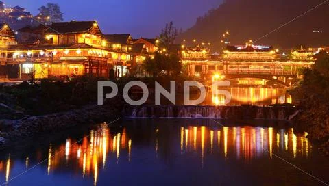 Night lighting constructions in the Chinese village of ethnic minorities. Stock Photos