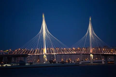Night lightinig of cable-stayed bridge of Western highway in St. Petersburg Stock Photos