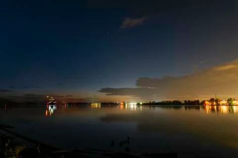 Night with lights and reflection on the river Stock Photos