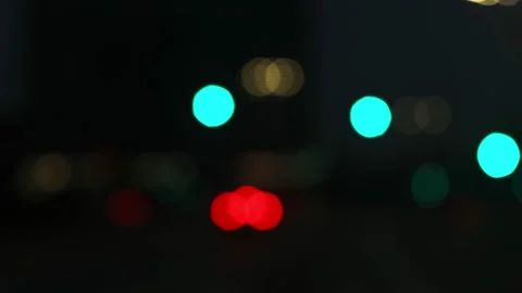 Night lights blurred bokeh view through car window. Stock Footage 143617643