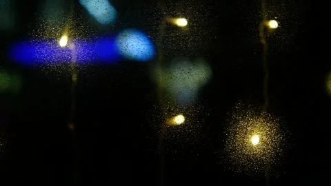 Night lights in city window, dark color, raindrops on glass Stock Footage 296774348