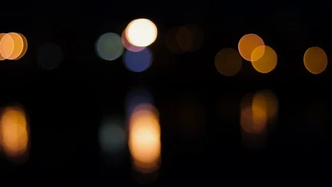 Night lights on the sea bokeh, reflection of the night sky in the water, boke Video stock 128448479