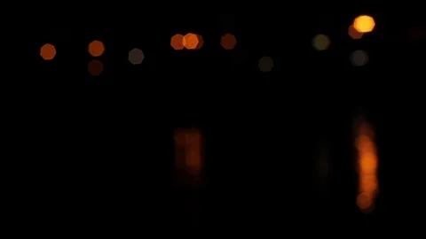 Night lights on the sea bokeh, reflection of the night sky in the water, boke Video stock 128448482