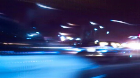 Night Lights Streak as we Travel Down a City Street Stock Footage