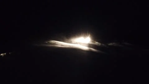 Night long shot of van UAZ headlights stucked in siberian snow-storm Stock Footage 164017554