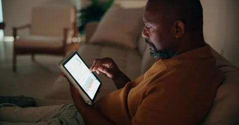 Night, man and remote work in home with tablet, data analysis and monitor stock Stock Footage 337757313