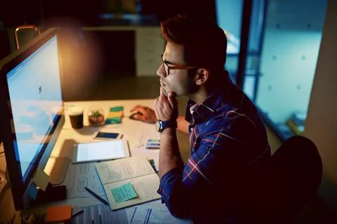 Night, man and thinking at computer for planning, web development and Stock Photos