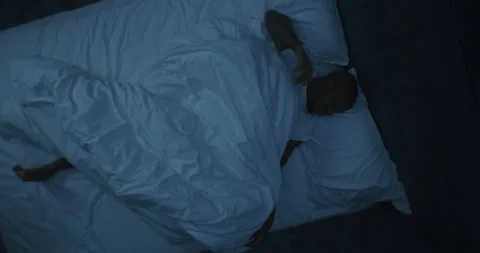At Night, Man in Bed Has Restless Dreams Stock Footage 318153165
