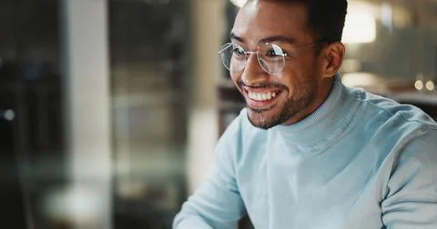 Night, man or smile with computer at agency for breaking news, draft editing or Stock Photos