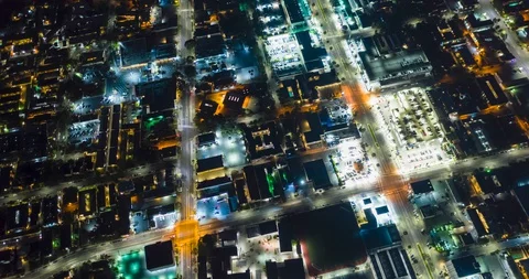 Night Medium Circle over Buildings with Traffic Aerial Motion Time Lapse Stock Footage 129409556