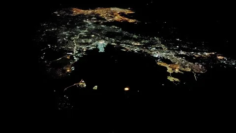 Night metropolis from height of flight on plane, view through passenger window Stock Footage 307200818