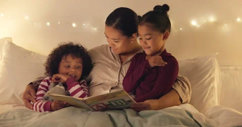 Night, mom and reading book with children in bedroom for story time, fantasy or Stock Footage 335305070