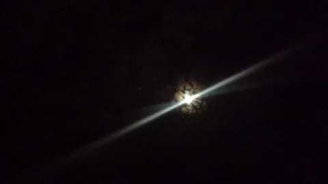 The Night Moon Shines in the Sky Through the Clouds Like a Star Stock Footage 83284845