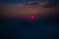 The night mountain on the background of sunrise. Wide angle Photo