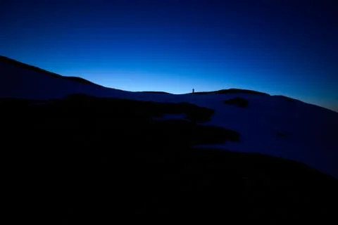 Night mountains landscape view with dark deep blue sky stars and sunset dusk Stock Photos