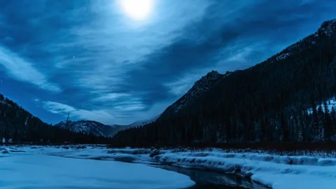 Night mountains with stream and moon in the winter Stock Footage 310543018