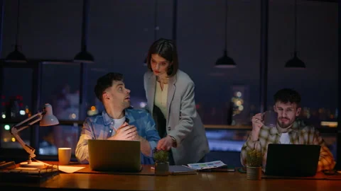 Night office work atmosphere. Three auditors solving tasks speaking at evening Stock Footage 339299388