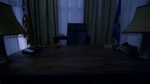 Night in the Oval office low angle pull back from desk Stock Footage 87719747