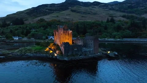Night over Eilean Donan Castle and Loch Duich from a drone, Highlands, Scotland Stock-Footage 308422742