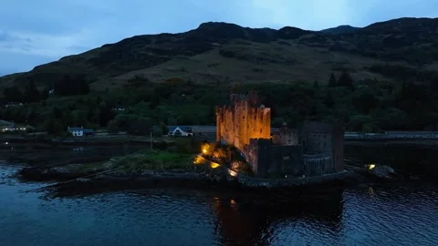 Night over Eilean Donan Castle and Loch Duich from a drone, Highlands, Scotland Stock Footage 308422755