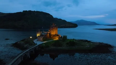 Night over Eilean Donan Castle and Loch Duich from a drone, Highlands, Scotland 스톡 동영상 308422789