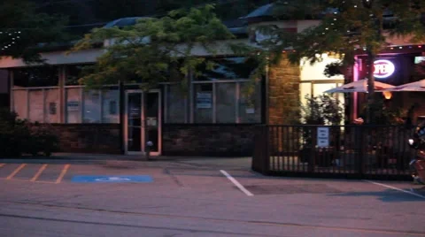 Night Pan Shot of Customers at Front Entrance to Pub Stock Footage 40300736