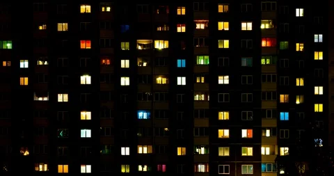 Night panorama time lapse of light in windows of multistory buildings. Stock Footage 117071758