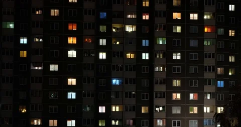 Night panorama time lapse of light in windows of multistory buildings Stock Footage 117187275