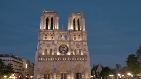 Night Panoramic Pan Left Illuminated Centered Facade Notre Dame Cathedral Paris Stock Footage 93406981