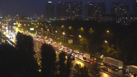Night panoramic view of traffic and Windows of houses on the outskirts of the Stock Footage 91936464
