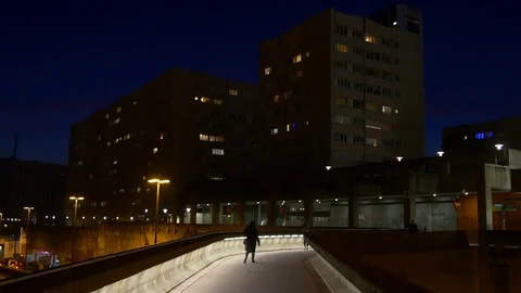 Night paris la defense block pedestrian walking bridge panorama 4k france Stock Footage 79865223