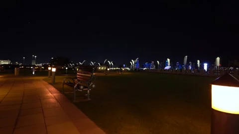 Night Park Bench with Doha Skyline View Stock-Footage 337043983