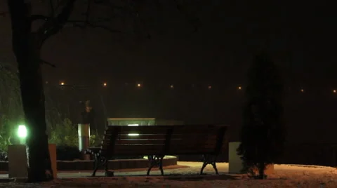 Night passer-by talks by a mobile. Stock Footage 1068073
