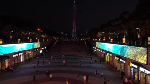 Night pedestrian square with illuminated tower in the background Stock Footage 341328762