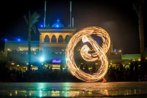 Night performance fire show in front of a crowd of people on the street in Eg Stock Photos