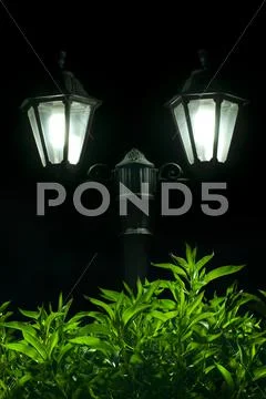 Night picture of the lamp in the park Stock Photos