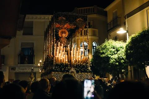 Night Procession, The Virgin of Solitude under Canopy, Carried by Costalero Stock Photos