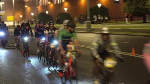 Night race of cyclists through the Central streets of the city,time lapse Video stock 138775100
